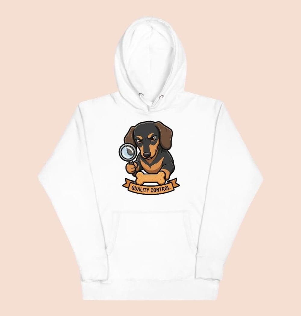 A clean badge featuring the pet as a very serious treat inspector, holding a magnifying glass over a biscuit, on a hoodie (example made with AI)