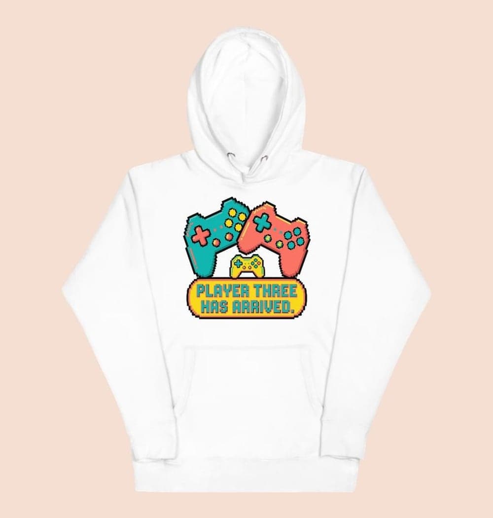 A cheerful original game-inspired emblem with two large controllers and one tiny controller between them, on a hoodie (example made with AI)