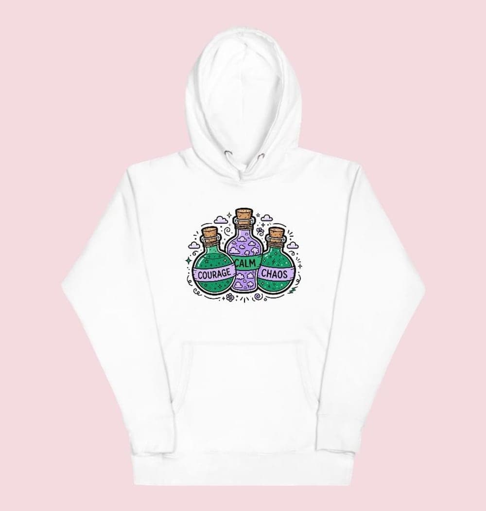 A compact illustrated cluster of three whimsical potion bottles labeled “COURAGE,” “CALM,” and “CHAOS.” Fill them with tiny stars, clouds, and sparks, on a hoodie (example made with AI)