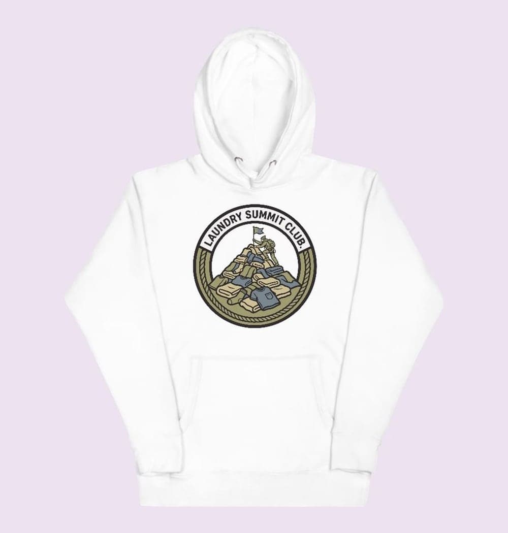 An original sports-style crest featuring a climber planting a flag atop a mountain of laundry, on a hoodie (example made with AI)