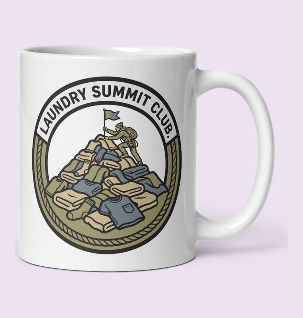 An original sports-style crest featuring a climber planting a flag atop a mountain of laundry, on a mug (example made with AI)