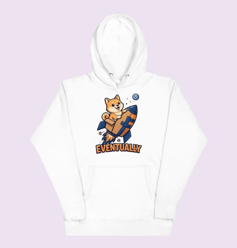 An original cheerful shiba-like dog riding a homemade cardboard rocket toward a tiny moon, on a hoodie (example made with AI)