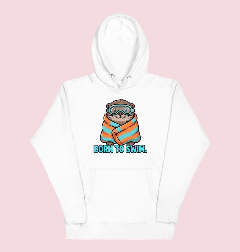 A cheerful original otter wearing swimming goggles and wrapped in an oversized towel, on a hoodie (example made with AI)