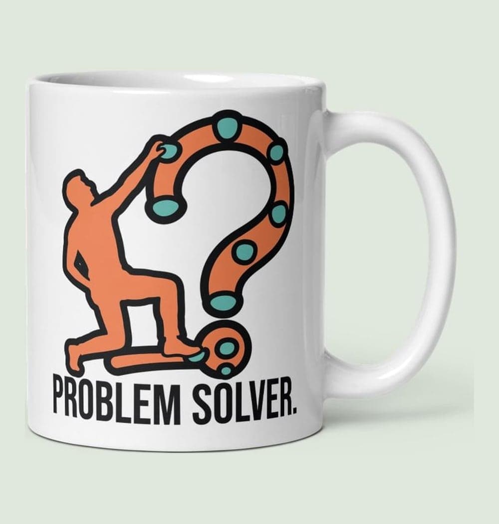 A bold graphic of a climber reaching for a final hold, with the climbing route forming a subtle question-mark shape, on a mug (example made with AI)