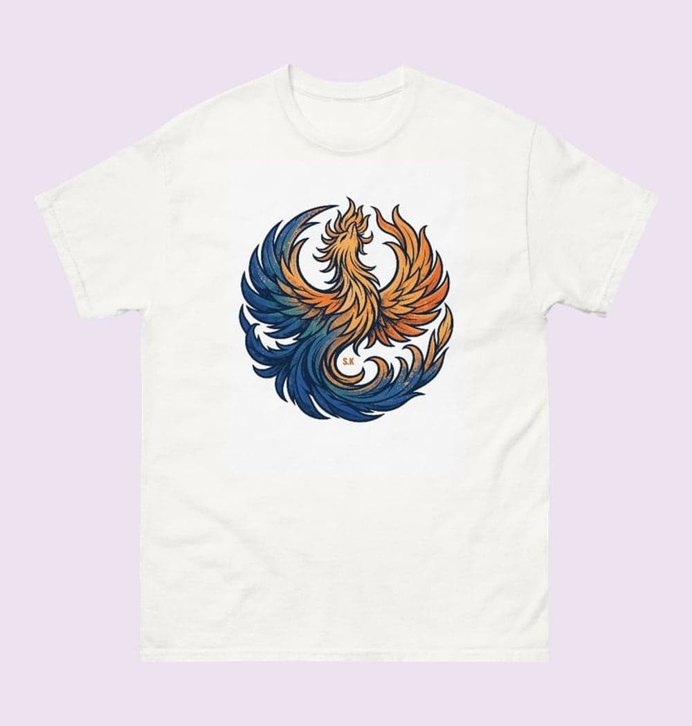 An original phoenix rising in a graceful circular composition, with feathers shifting from deep blue to warm orange, on a t-shirt (example made with AI)