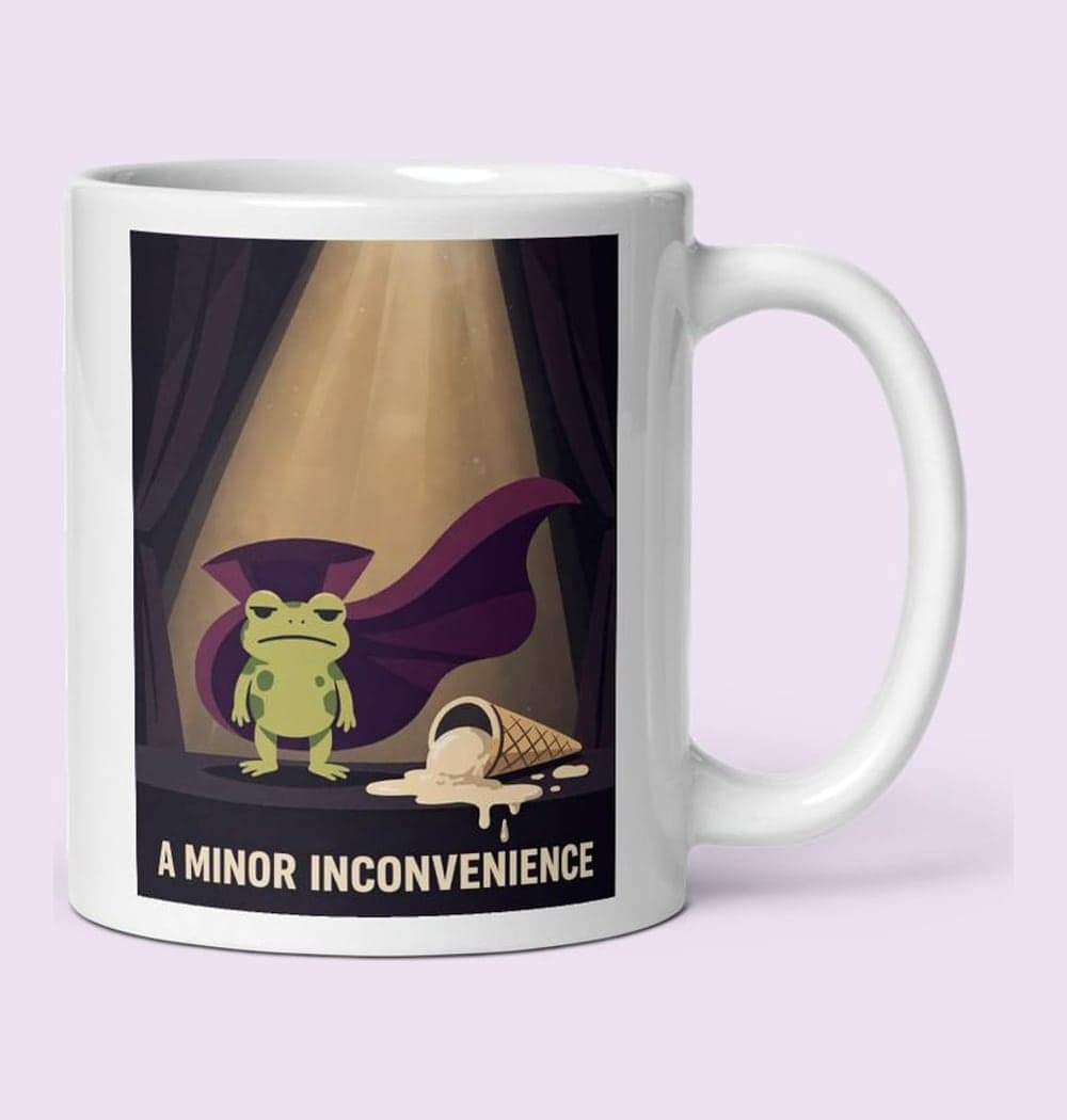 A tiny frog in a sweeping theatrical cape, standing under a spotlight beside a dropped ice-cream cone, on a mug (example made with AI)