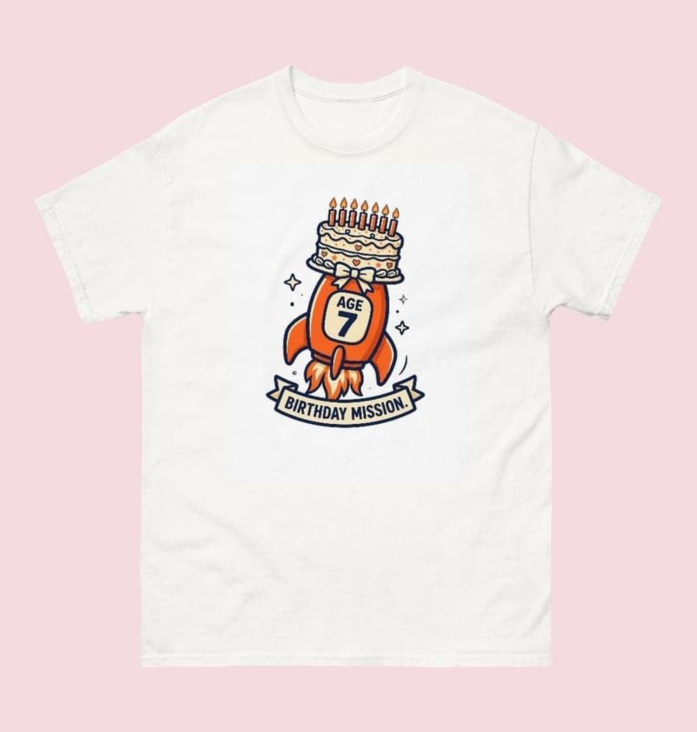 An original cartoon rocket carrying a birthday cake with the supplied age displayed clearly on its side, on a t-shirt (example made with AI)